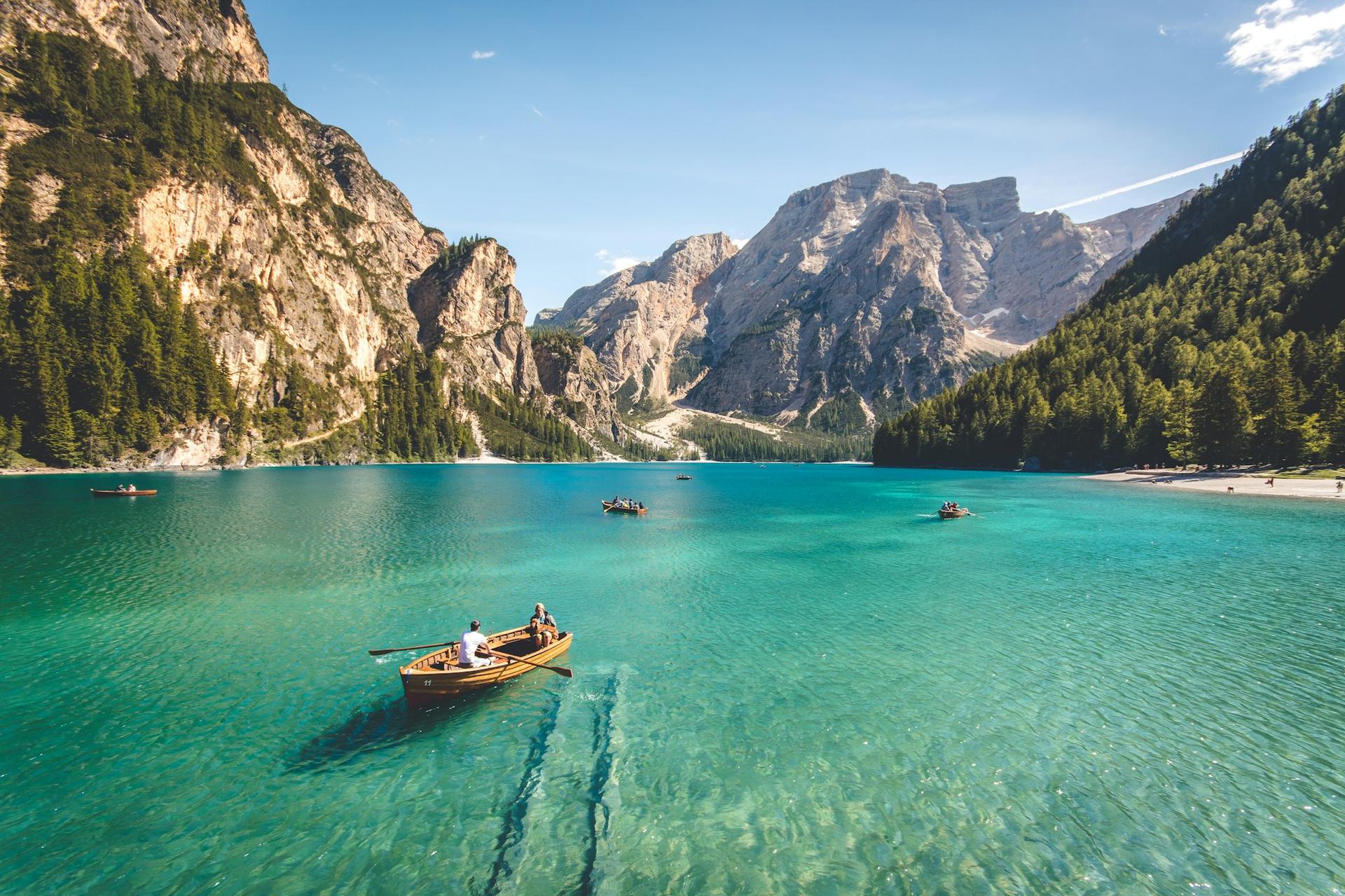Turquoise alpine lake with a rowing boat